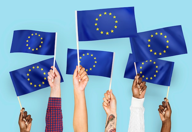 Hands waving flags of the europeanunion Free Photo