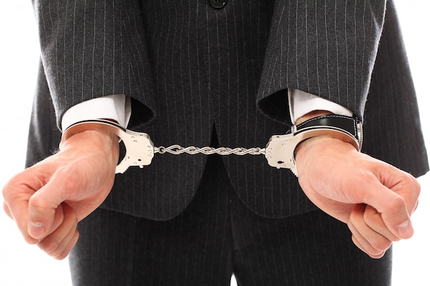 Hands of young man in handcuffs Free Photo