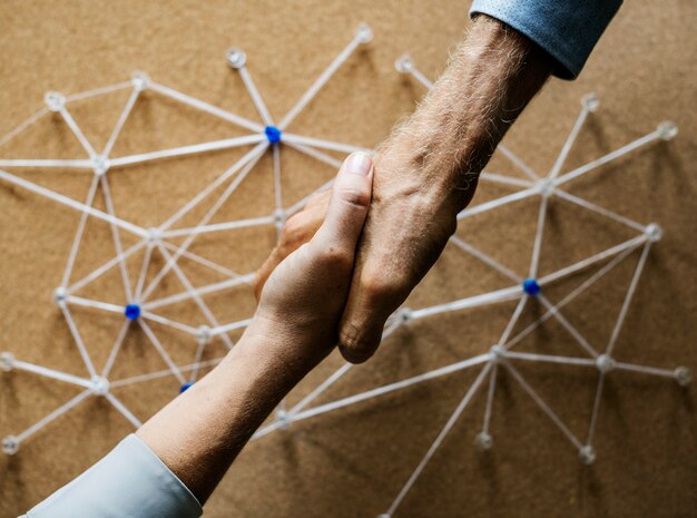 Premium Photo | Handshake connecting over network simulation