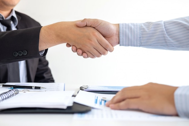 Premium Photo | Handshake of two business people after contract ...