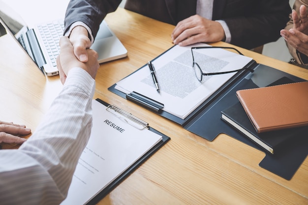 Handshake while job interviewing, candidate shaking hands with interviewer after a job interview Premium Photo