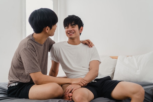 Handsome Asian Gay Couple Talking On Bed At Home You