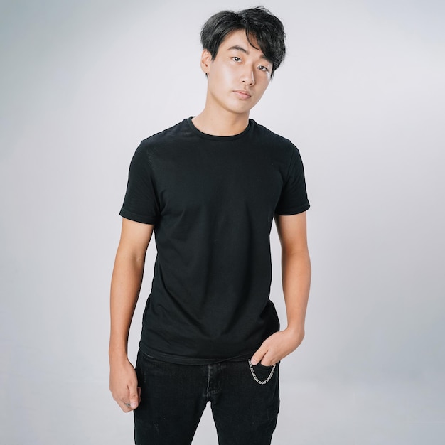 Premium Photo | Handsome asian man black tshirt serious standing ...