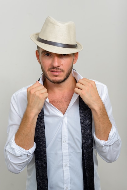 Premium Photo | Handsome bearded hispanic businessman wearing hat on white