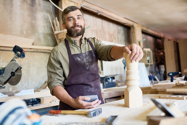 Premium Photo | Handsome carpenter at work