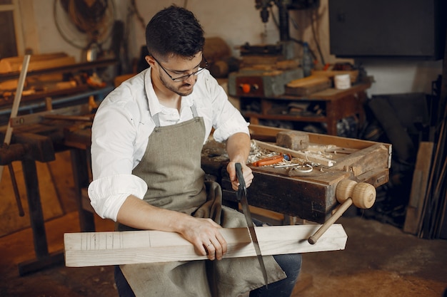 Free Photo | Handsome carpenter working with a wood