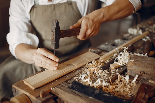 Free Photo | Handsome carpenter working with a wood