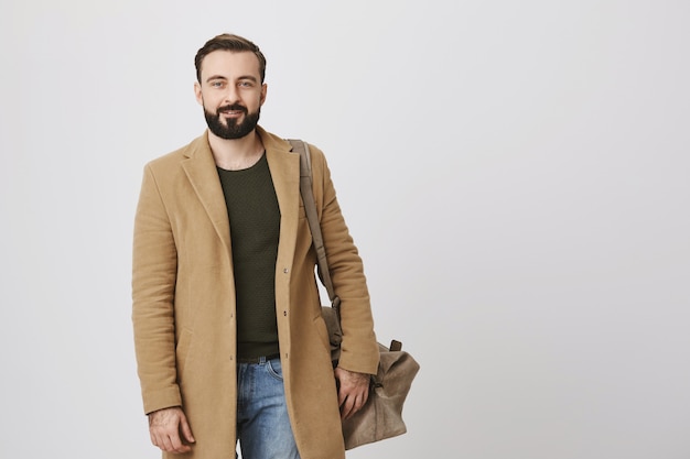 Free Photo Handsome male entrepreneur in trench coat