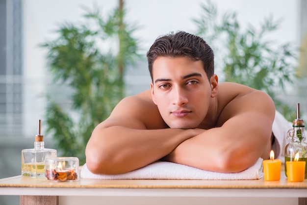 Handsome man during spa massaging session Premium Photo