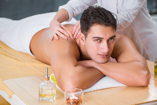 Handsome man during spa massaging session Premium Photo