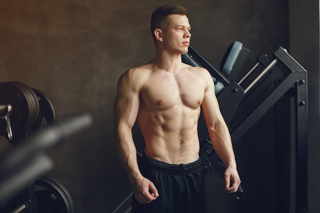 Free Photo | A handsome man is engaged in a gym