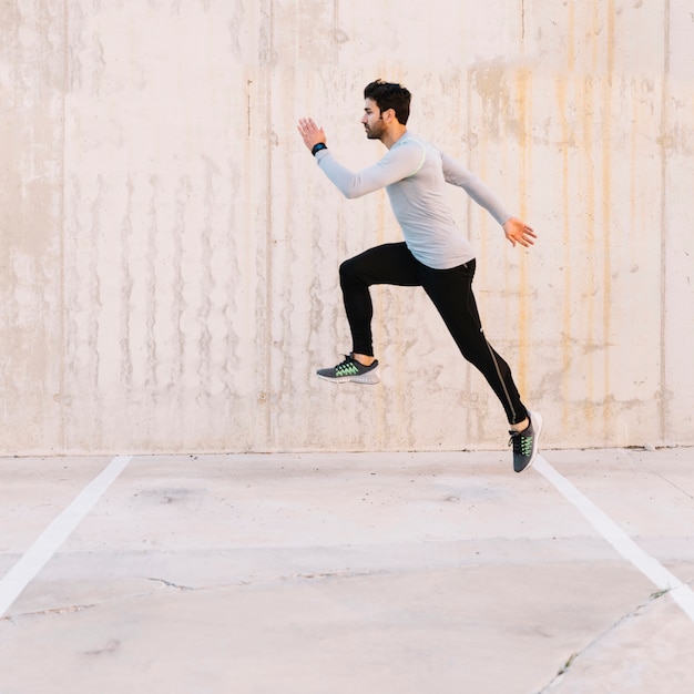 Premium Photo | Handsome man leaping during training