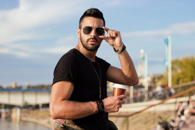 handsome-man-outdoors-drinking-coffee-with-sunglasses-a-guy-with-beard-instagram-effect_1212-819.jpg