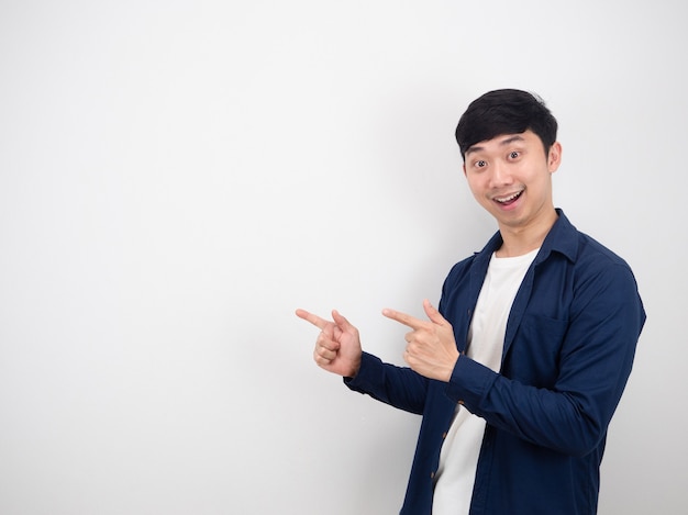 Premium Photo Handsome Man Point Double Finger Left Side With Happy Smile Looking At Camera On 1342