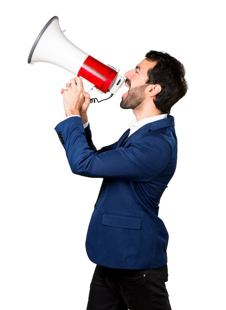 Free Photo | Handsome man shouting by megaphone