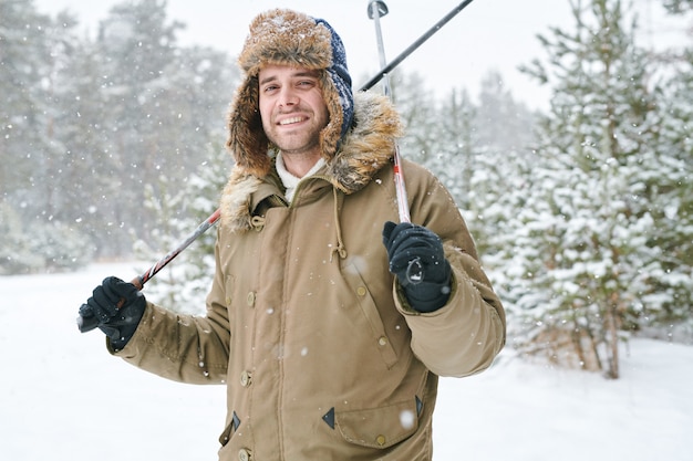 Premium Photo | Handsome man skiing in forest