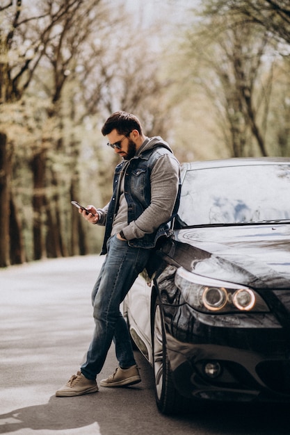 Handsome Man Standing By The Car In The Park Free Photo