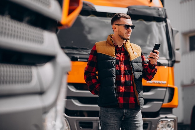 Handsome Man Truck Driver Standing By The Truck Free Photo