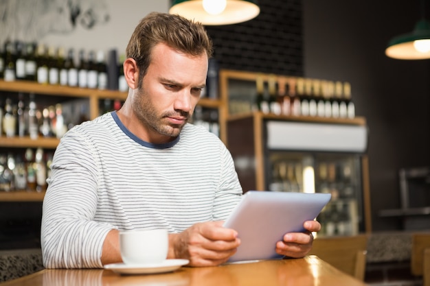 Handsome man using tablet computer Premium Photo