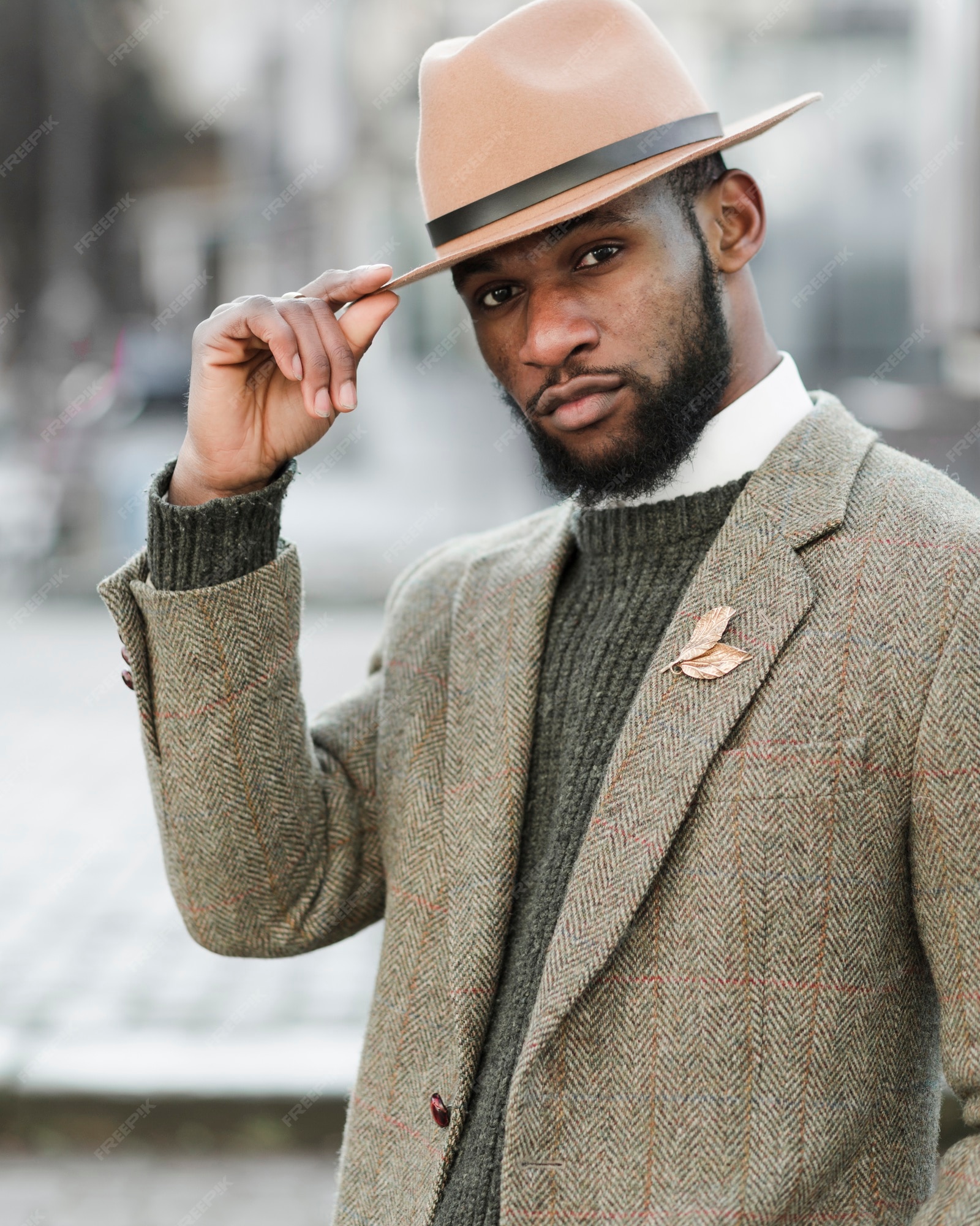 Free Photo | Handsome man with hat posing