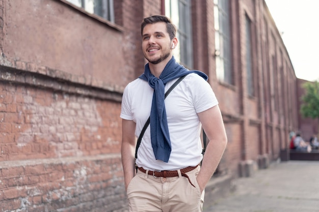 Premium Photo | Handsome young man on a walk in town