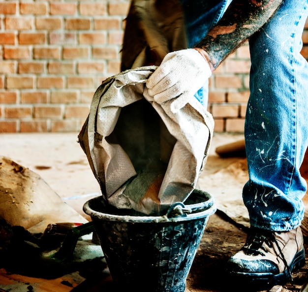 Handyman prepare cement use for construction Photo | Free ...
