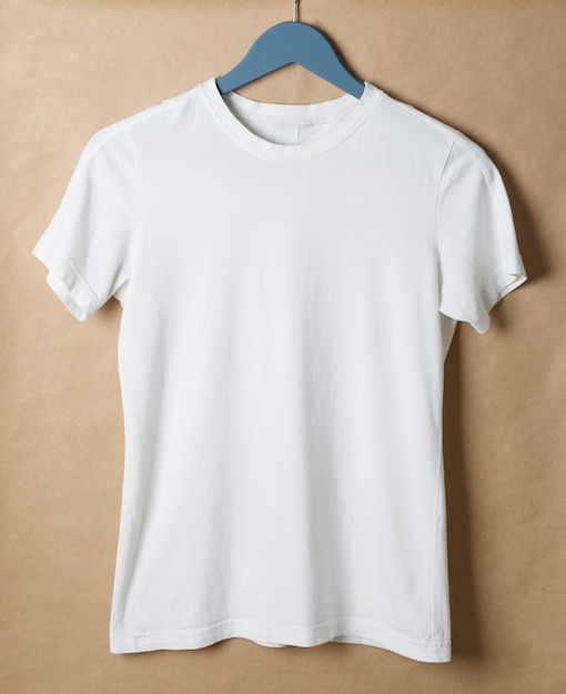 Premium Photo | Hanger with blank white t-shirt on cardboard