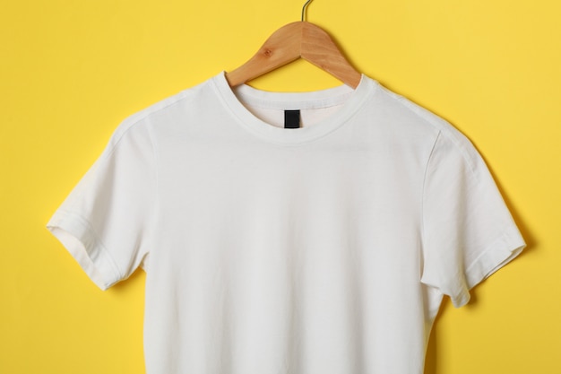 Premium Photo Hanger With Blank White T Shirt On Yellow