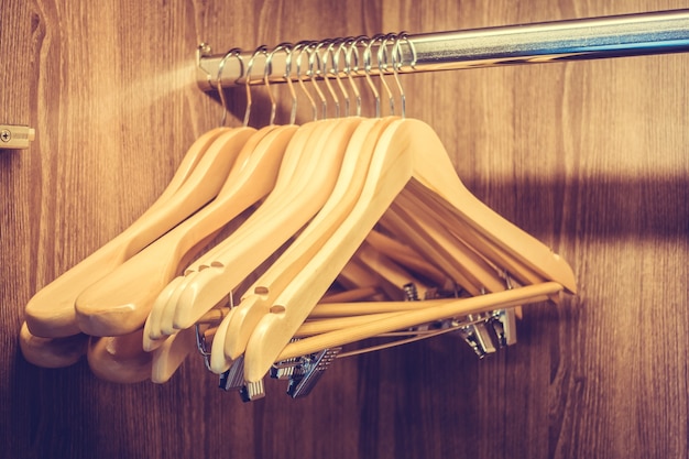 Free Photo | Hangers in a wooden closet