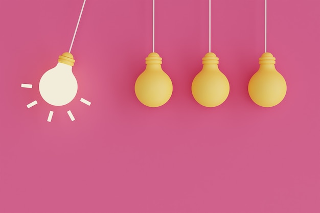  Hanging light bulbs with one of them glowing on pink background Premium Photo