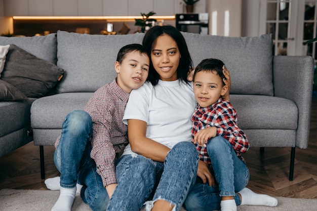 Premium Photo | Happy african american family mom and two sons fooling ...