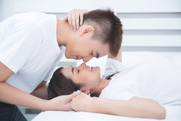 Free Photo | Happy asian couple on the bed at home