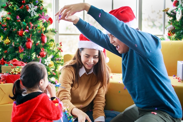 Premium Photo | Happy asian family daughter wears sweater sitting with ...