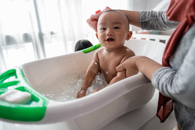 Baby Taking Bath Images : Adorable Toddler Kid Taking Bath In Blue Baby Bathtub Free Stock Photo And Image - See child taking bath stock video clips.