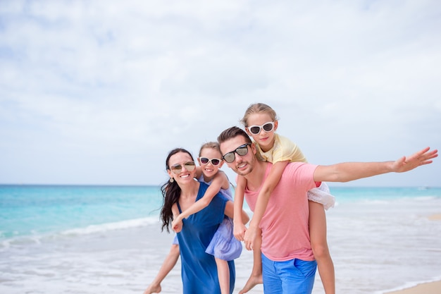 Premium Photo | Happy beautiful family on the beach