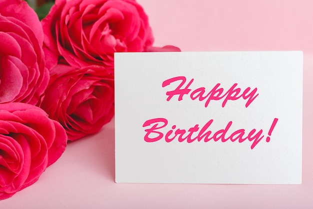 Premium Photo Happy Birthday Text On Card In Flower Bouquet On Pink Background Flower Delivery Congratulation Card Greeting Card In Pink Red Roses