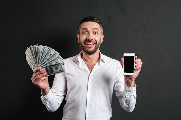 Premium Photo | Happy businessman showing display of mobile phone ...