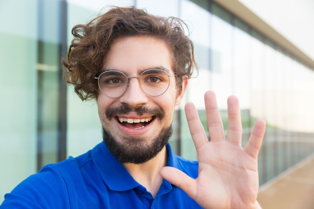 Free Photo Happy Cheerful Guy Wearing Glasses Waving Hello