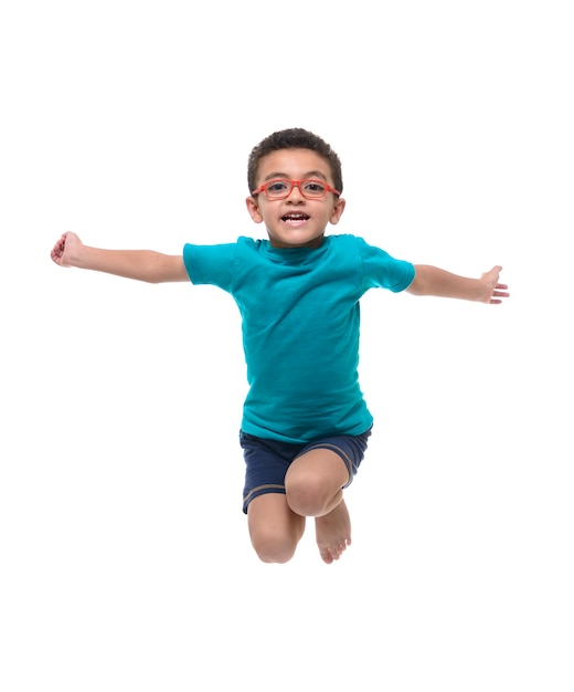 Premium Photo | Happy child jumping in the air