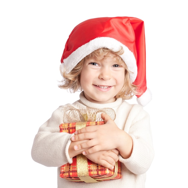 Premium Photo | Happy child with christmas gift isolated on white ...