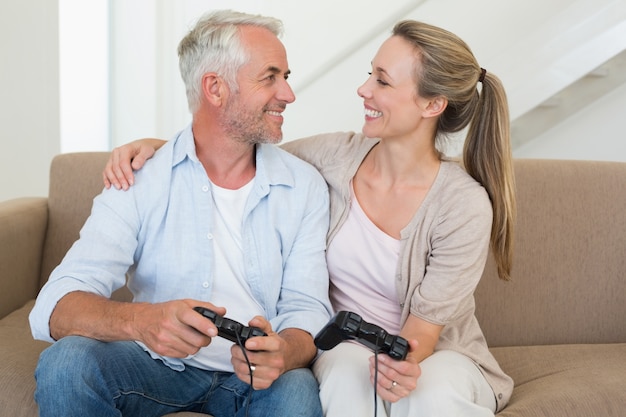 Premium Photo Happy Couple Having Fun On The Couch Playing Video Games