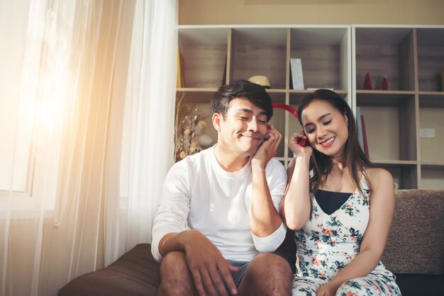 Happy Couple Is Relaxing And Playing Together The Living Room Photo