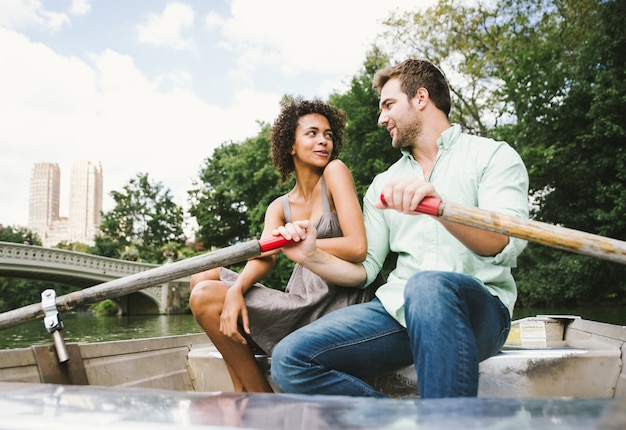 Premium Photo | Happy couple taking a boat ride in central park, new york