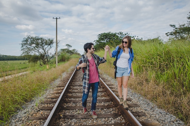 Free Photo | Happy couple on train tracks