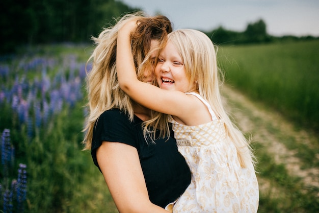 Premium Photo | Happy excited mother hugging her beautiful smiling ...