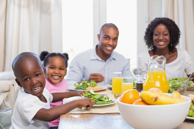 Premium Photo | Happy family enjoying a healthy meal together