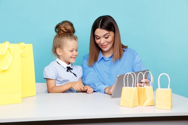 Premium Photo | Happy family online shopping concept. mom and child ...