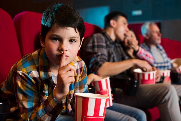 Free Photo | Happy family sitting in cinema