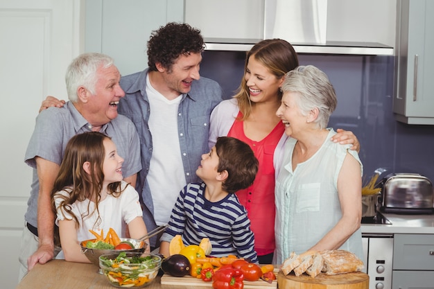 Premium Photo | Happy family standing in kitchen