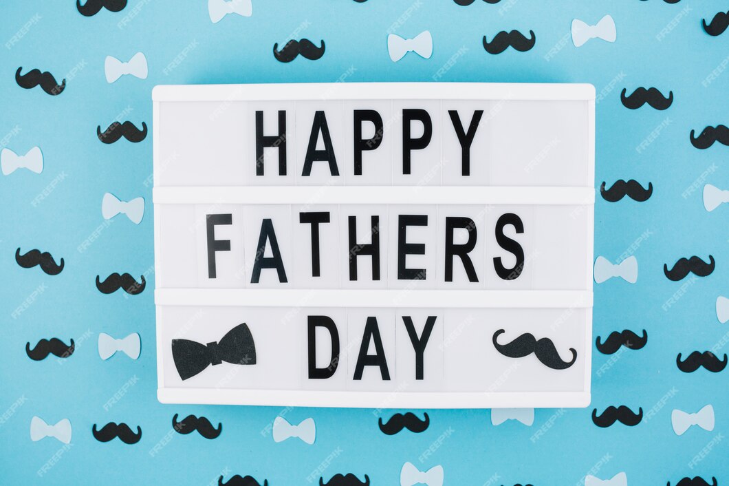 Free Photo | Happy fathers day title on tablet between decorations